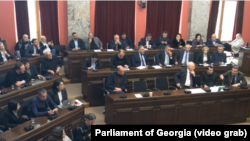 Georgia's parliament was discussing a controversial "foreign agent" law when the fighting erupted. 