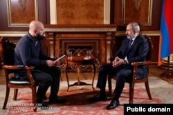 Armenian Prime Minister Nikol Pashinian (right) gives an interview to accused Russian spy Pablo Gonzalez, who represented the Spanish news agency EFE, in Yerevan in October 2020.