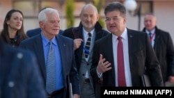 EU envoys Josep Borrell (left) and Miroslav Lajcak arrive for meetings as part of the talks in Ohrid on March 18.