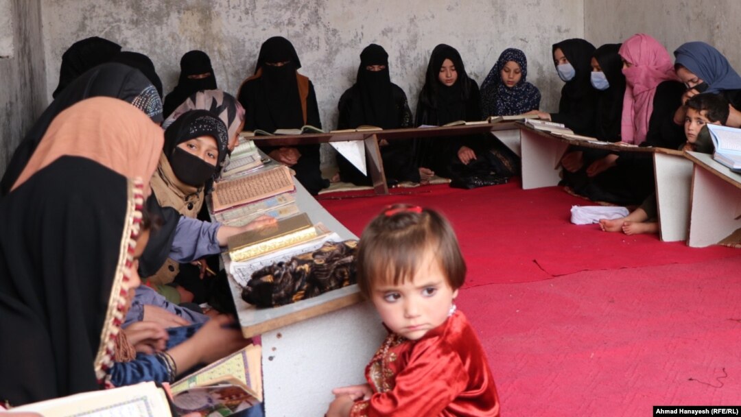 Girls attend a private religious studies school, or madrasah, in Afghanistan's Parwan Province. Since regaining power, the Taliban has converted scores of secular schools, public universities, and vocational training centers into Islamic seminaries.