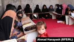Girls attend a private religious studies school, or madrasah, in Afghanistan's Parwan Province. Since regaining power, the Taliban has converted scores of secular schools, public universities, and vocational training centers into Islamic seminaries.