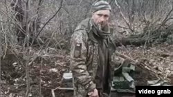  The video appears to show an unidentified, detained Ukrainian soldier standing in a trench being shot dead with automatic weapons after saying, "Glory to Ukraine."