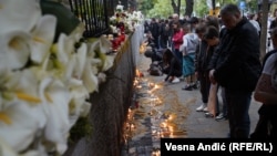 People leave flowers, toys and candles outside the school in Belgrade on May 4.