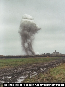 An explosion at an unidentified WMD site.