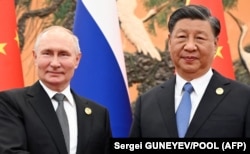 Президент России Владимир Путин и глава Китая Си Цзиньпин во время встречи в Пекине, 18 октября 2023 года