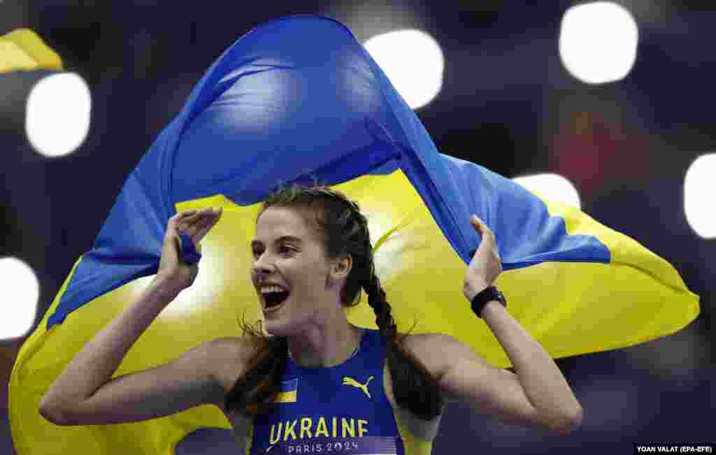 Yaroslava Mahuchikh of Ukraine celebrates after winning the women&#39;s high jump at the Summer Olympics in Paris.