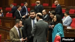 Armenia - Deputies from the ruling Civil Contract party talk on the parliament floor, Yerevan, March 1, 2023.