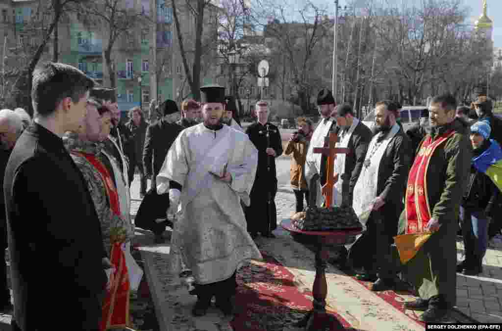 Orthodox priests held a special memorial for the relatives, friends, and colleagues of those killed as part of the commemoration.