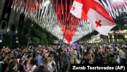 Demonstrators take to the streets of Tbilisi on May 28 to protest against the "foreign agents" law, which critics have compared to similar legislation in Russia widely used to suppress dissent and weaken democratic institutions.