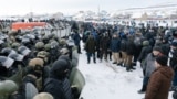 Riot police disperse protesters in the town of Baimak on January 17.