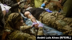 Once the wounded are pulled out of battle, often after too many hours waiting for help, they're brought to a stabilization point where doctors and paramedics try to keep them alive long enough to make it to the hospital.