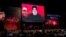 Supporters listen to the speech of Hizballah leader Sayyed Hassan Nasrallah on a video screen in Beirut on August 6.