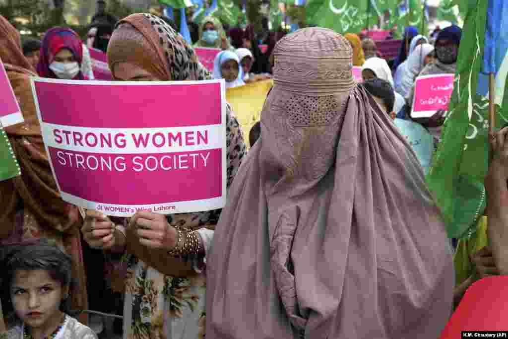 Women supporters of the religious party Jamaat-e-Islami participate in a rally to mark International Women&#39;s Day in Lahore, Pakistan, on March 8.