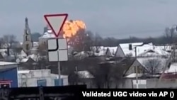 A screen grab from a video shared on social media that appears to show an aircraft spiraling to the ground and exploding in Russia's Belgorod region on January 24.
