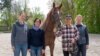 Turkmenistan's former president, Gurbanguly Berdymukhammedov (second from right), is seen visiting a horse center in Germany.