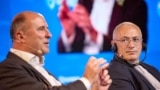 Mikhail Khodorkovsky (right) listens to a speaker at the 2024 Globsec international security forum in Prague on August 31.