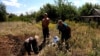 Residents Resort To Burying Their Dead In Backyards On Ukraine's Eastern Front GRAB 2