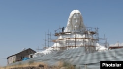 Armenia - A fragment of the giant statue of Jesus Christ hewn in Zovuni village, August 26, 2024.