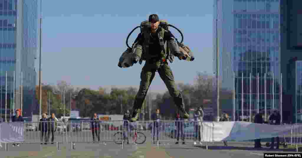 A man flies with a jet suit during a demonstration flight at the GoTech World 2023 digital international exhibition in the Romanian capital, Bucharest.&nbsp;