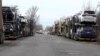 Armenia - Car carrier trailers line up near a customs terminal outside Gyumri, March 13, 2023