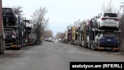 Armenia - Car carrier trailers line up near a customs terminal outside Gyumri, March 13, 2023