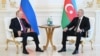 Russian President Vladimir Putin speaks with Azerbaijani President Ilham Aliyev Aliyev on June 18.