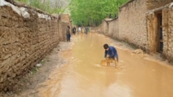 Muddy Floodwaters Surge Through Afghan Villages
