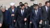 Kyrgyz President Sadyr Japarov (center left) and businessman Khabibula Abdukadyr (center right) attend a ground-laying ceremony for a giant mosque near Bishkek on March 10. 