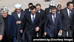 Kyrgyz President Sadyr Japarov (center left) and businessman Khabibula Abdukadyr (center right) attend a ground-laying ceremony for a giant mosque near Bishkek on March 10. 