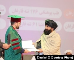 Nida Mohammad Nadim, the Taliban’s higher education minister, gives a diploma to a newly graduated Kabul medical university student in November.