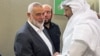 Лидер ХАМАС Исмаил Хания (крайний слева) в Дохе, Катар, 11 апреля 2024 года 