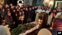Relatives and supporters bid farewell to opposition leader Aleksei Navalny at a Moscow church on March 1.