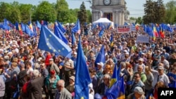 People take part in a pro-EU rally in Chisinau in May. 