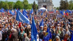 People take part in a pro-EU rally in Chisinau in May. 