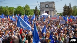 People take part in a pro-EU rally in Chisinau on May 21.