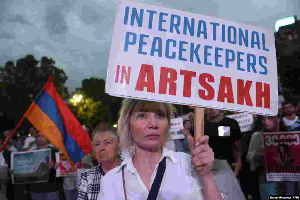 A woman calling for intervention in Nagorno-Karabakh, which Armenians refer to as Artsakh.&nbsp;