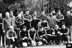 The Soviet national team gathers for a workout in an unidentified place in Russia in November 1969. Yevgeny Lochev is third from left, kneeling.