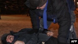 Sannikau lay on a street after being beaten during a clash between protesters and police in Minsk on election night in December 2010.