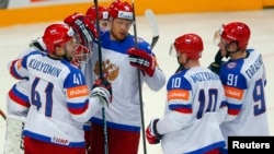 Russian players celebrate defeating the United States in their Ice Hockey World Championship semifinal game in Prague.