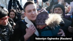 Nadia Savchenko embraces a supporter after being detained in Kyiv on March 22 on charges of planning a military-style coup.