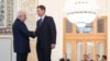 Iranian Foreign Minister Mohammad Javad Zarif (left) shakes hands with British Foreign Secretary Jeremy Hunt, in Tehran, November 19, 2018