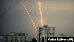 Russian rockets launches against Ukraine from Russia's Belgorod region are seen at dawn in Kharkiv on August 15.