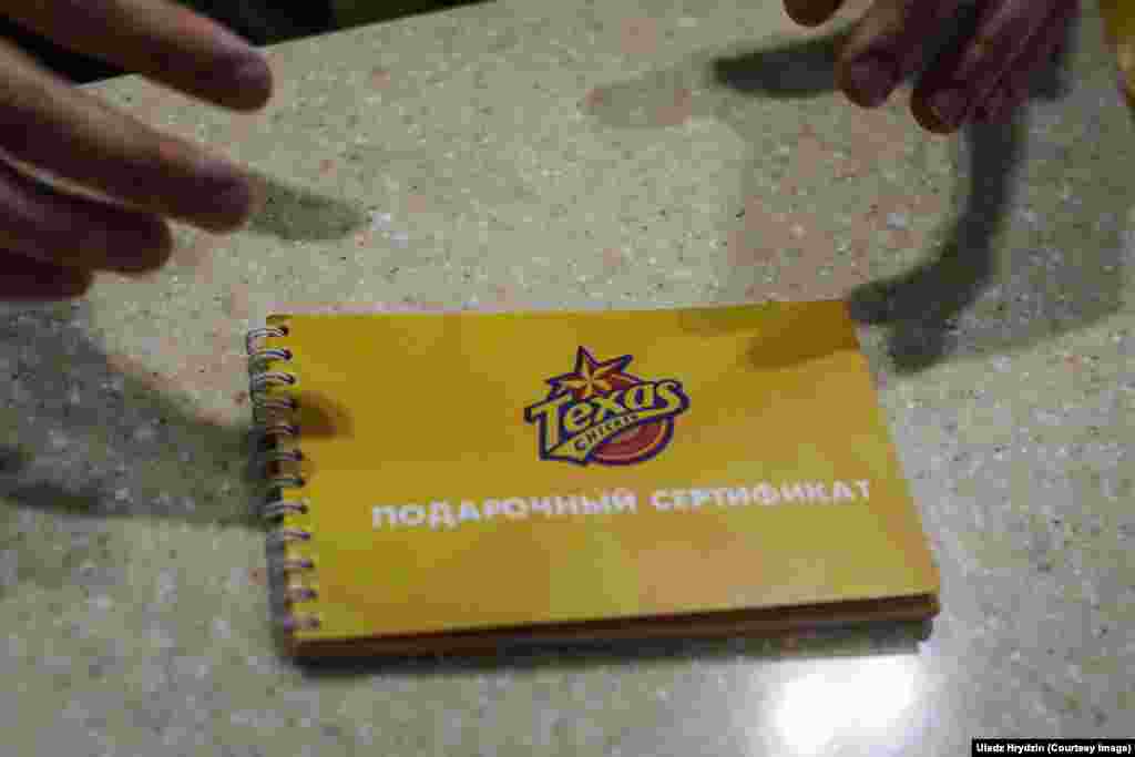 A gift certificate on the counter, awaiting its transformation into fried chicken.