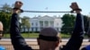 A Uyghur activist rallies in front of the White House. (file photo)