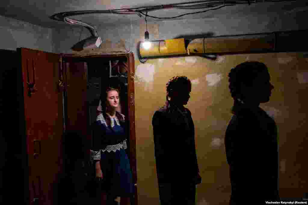 Students enter a bomb shelter in Kyiv as they conduct an air-raid alarm drill amid Russia&#39;s attack on Ukraine.
