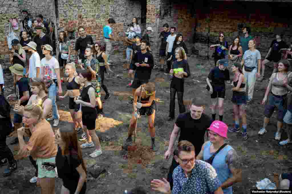 Hundreds of volunteers have joined in to clean up and repair damaged buildings.