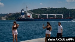 The Sierra Leone-flagged cargo vessel Razoni sails along the Bosphorus Strait past Istanbul on August 3 after being officially inspected.
