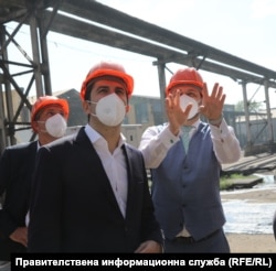 In July, then-Prime Minister Kiril Petkov (center) and then-Environment Minister Borislav Sandov (right) visited the Brikel plant as part of an inspection and found "mind-boggling violations."