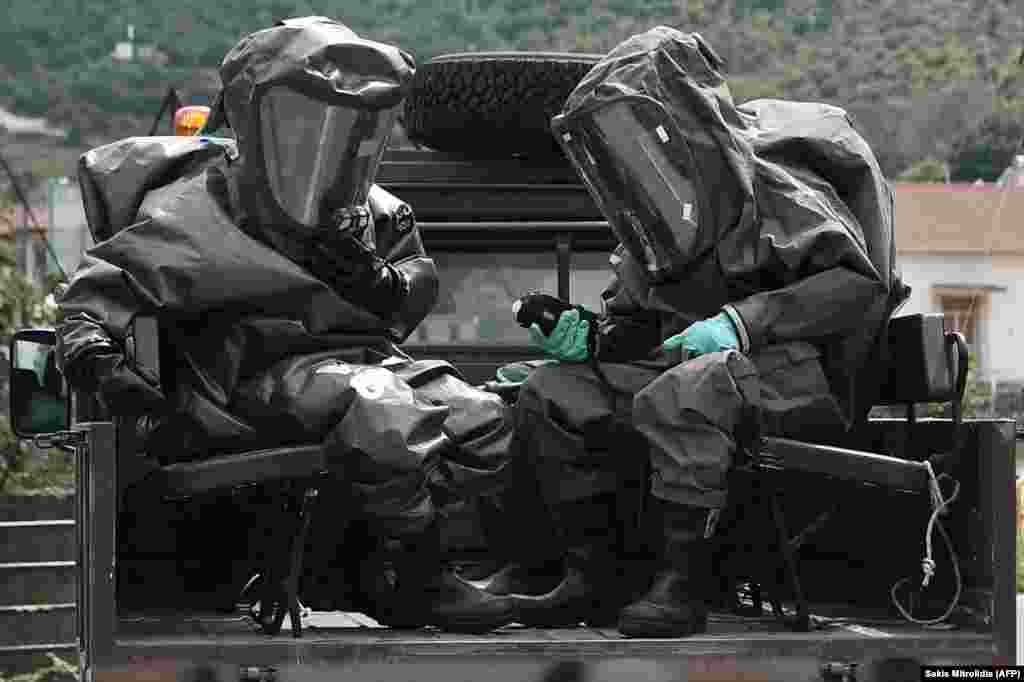 Men in hazmat suits near the crash site on July 17. Greece&rsquo;s Civil Protection Authority instructed residents of nearby villages to stay inside with their windows shut while the site was being investigated.&nbsp; &nbsp;