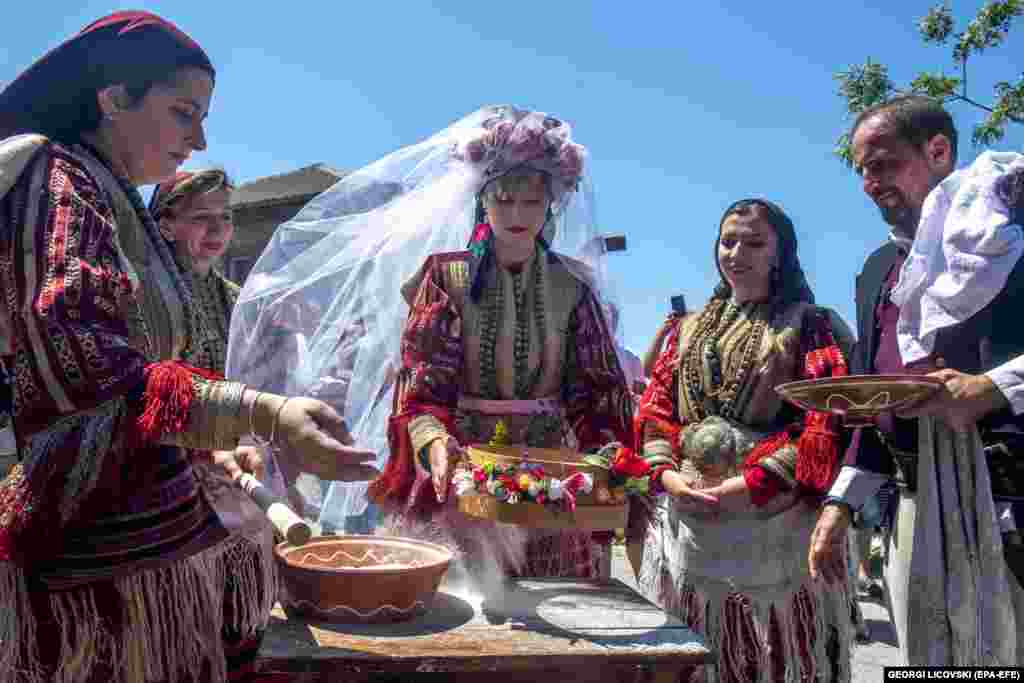 One of the bride&#39;s traditions involves sifting flour.